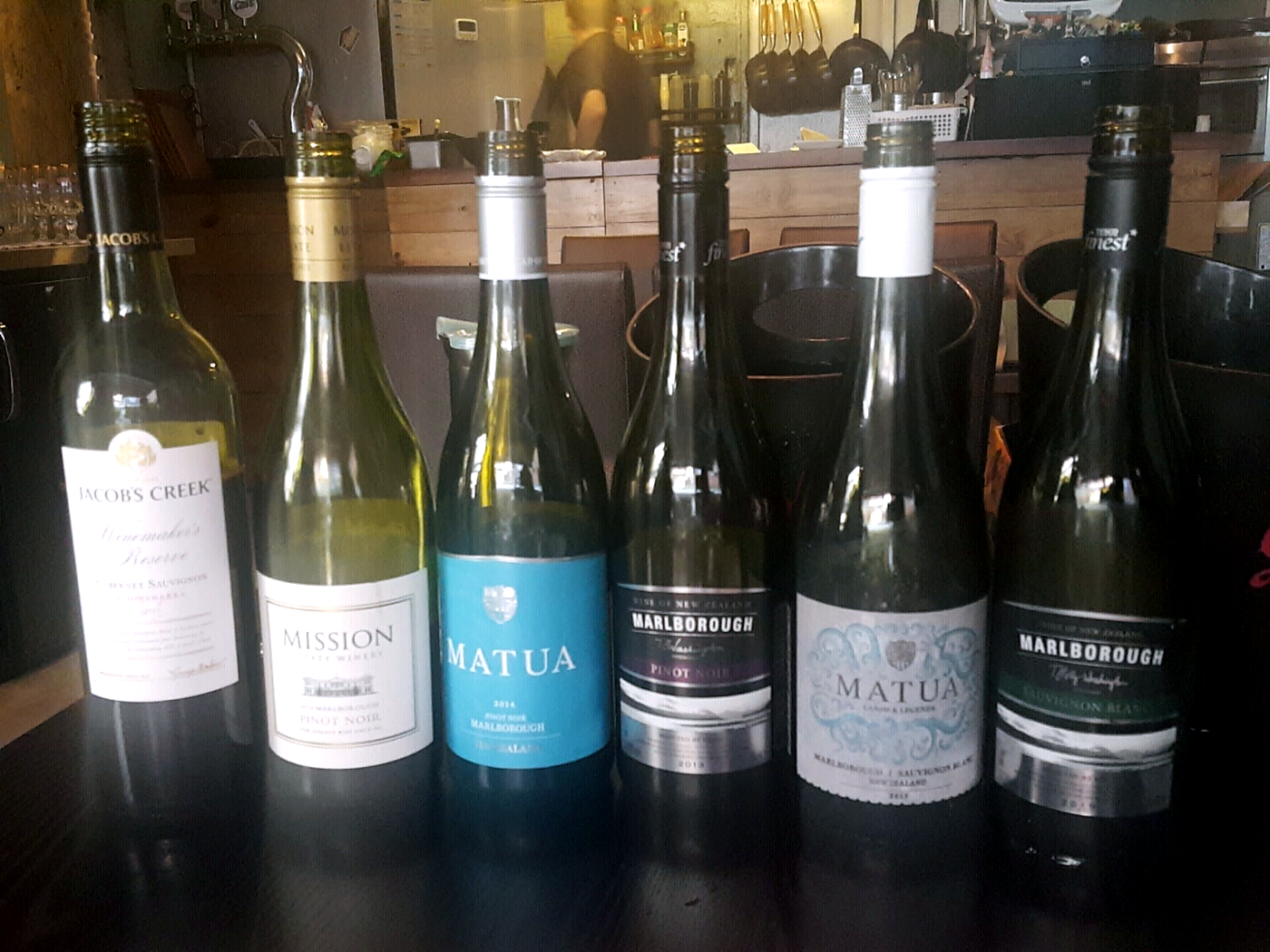 Marlborough Pinot Noir and Sauvignon Blanc bottles on the table at the June 5, 2016 New Zealand wine gathering